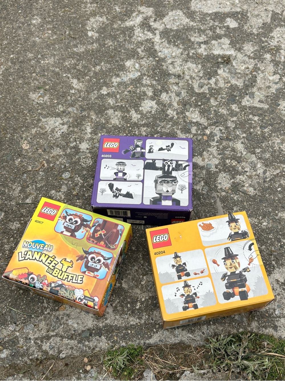 Lego boxed mini build sets in Yellow, Purple, Orange